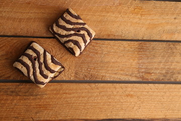 small chocolate cakes in color background