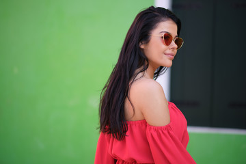 traveler woman posing among colorful houses on Burano island, Venice. Tourism in Italy concept