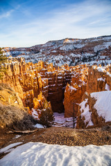 Cliffs of Bryce Canyon National Park covered with snow during Winter 
