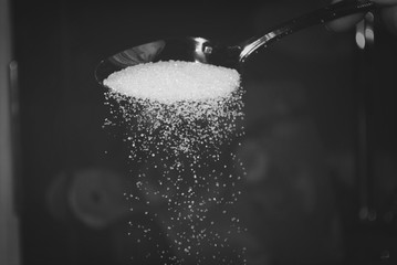 Obraz na płótnie Canvas Close Up Of Sugar Crystals Against Blurred Background