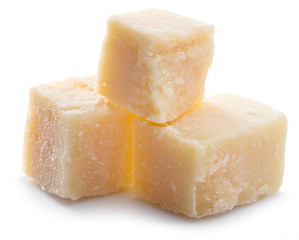 Parmesan cheese cubes isolated on white background.