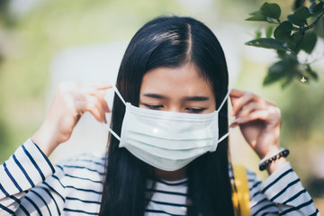Woman wearing protective mask from pm 2.5 air pollution.