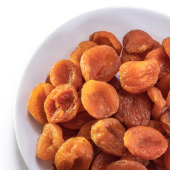 Dried apricots on a white isolated background. Delicious raisins food yellow for your design for the site. kitchen theme