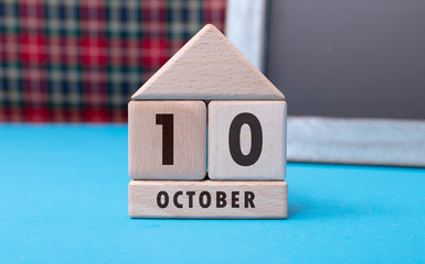 October 10 written with wooden blocks