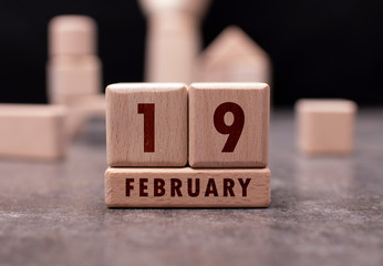 February 19 written with wooden blocks