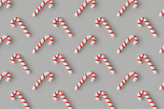 Christmas pattern with candies on pastel gray background. Minimal holiday wrap concept.