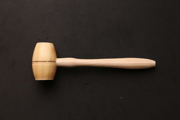 small wooden mallet made of pine wood
