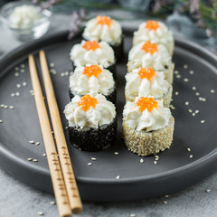 Serving sushi on a grey plate