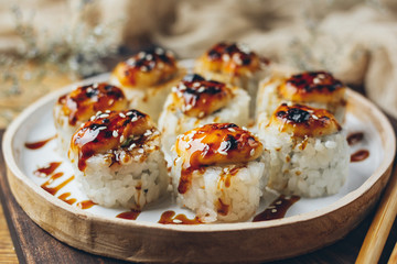 Sushi with a cheese cap