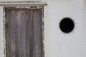 Wooden door with cirlce window. Old Texture With Natural Pattern