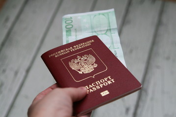 foreign passport of the Russian Federation with an enclosed 100 Euro bill
