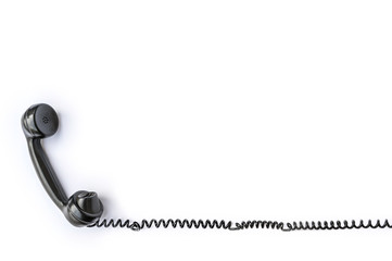 Telefonhörer eines alten Telefons freigestellt vor weißem Hintergrund als Vorlage für...