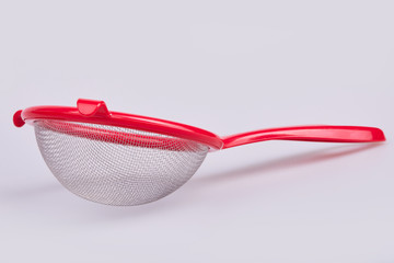 Metallic and plastic colander for cooking (kitchenware collection) on white background. Strainer Sieve