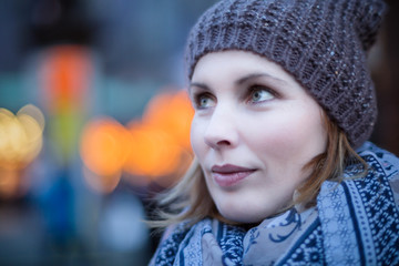 Close-Up Of Woman Wearing Knit Hat Standing Outdoors During Winter