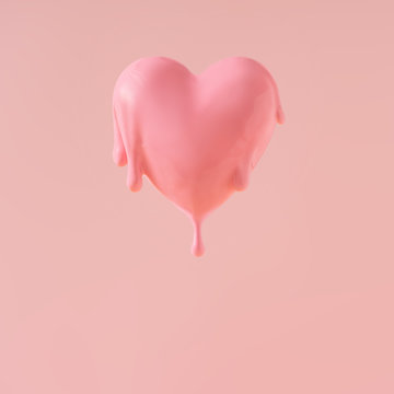 Heart with pink paint dripping. Minimal love concept.