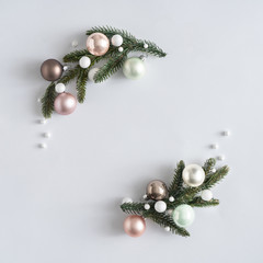 Natural Christmas wreath with green pine tree branches and ball decoration. Creative copy space layout. Flat lay background.