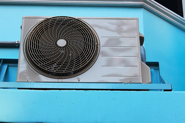 A compressor of air conditioner placed on the terrace
