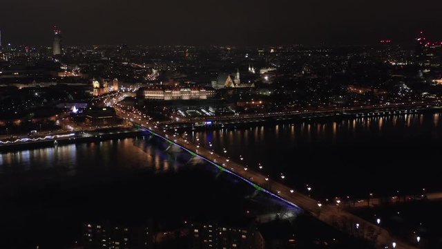 Aerial view of the historic center of the old city in Warsaw, view of the river hung and the bridge at night. Poland.