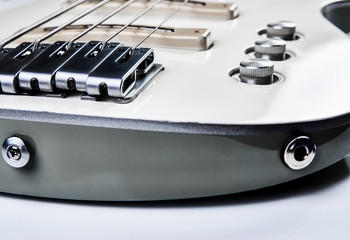White bass guitar details on a white background with copy space