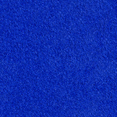 Dark blue felt material texture. Bright seamless background