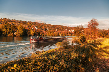 Peniche sailing on the Seine river in France on an autumn day