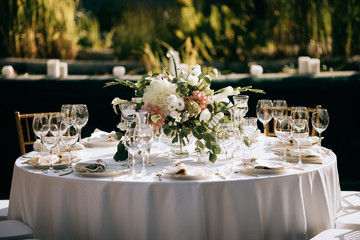 elegant table set, Table decoration at the wedding ceremony in the summer garden, catering service outdoor