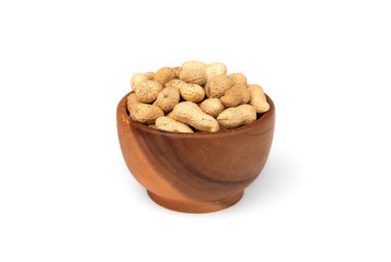 Peanut in the shell in wooden bowl isolated on white background.
