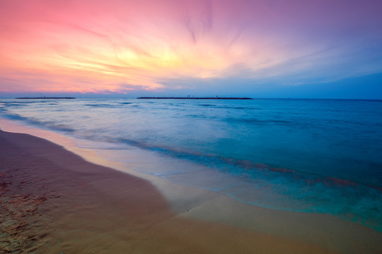 Early morning. Pink sunrise over the sea