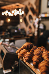 close up view on fresh croissants in coffee shop