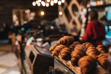 close up view on fresh croissants in coffee shop