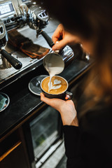 View on barista making coffee in coffee shop