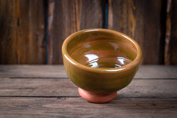 empty decorative bowls for shaving foam on wooden table, close view, barbershop concept 
