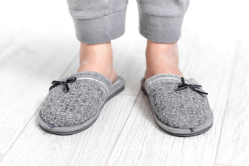 Modern portrait of home slippers light gray on white background for fashion lifestyle design. Home footwear design collection.