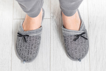Modern portrait of home slippers light gray on white background for fashion lifestyle design. Home footwear design collection.