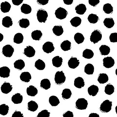 Seamless polka dot pattern hand drawn with a brush. Vector Monochrome Grunge texture of circles. Scandinavian background in a simple style for printing on textiles, paper, Wallpaper, print on t-shirts