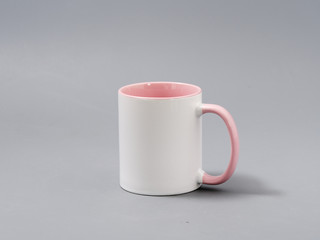 colored cups for sublimation in composition on a gray background