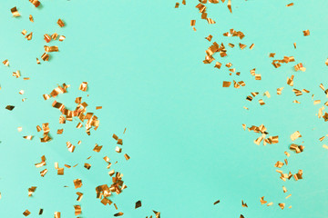 Golden flying sparkles on blue holiday background. Festive backdrop for your projects. - Image