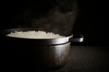Steamed rice in iron pot 