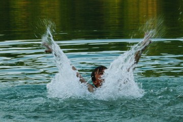 Playful Boy Enjoying In Lake