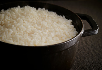 Steamed rice in iron pot 
