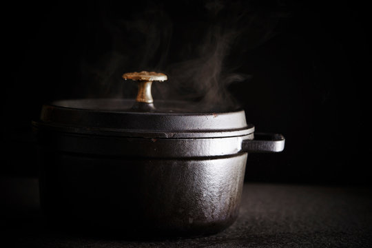 Black iron rice cooked on black background 