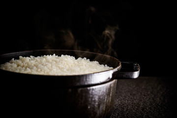 Steamed rice in iron pot 