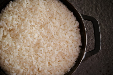 Steamed rice in iron pot 