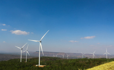 Landscape with hills and wind turbines background of mountains.wind energy converter, is a device that converts the wind's kinetic energy into electrical
