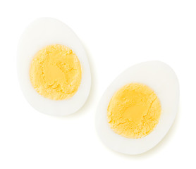 Two halves of a boiled egg on a white. The view from the top