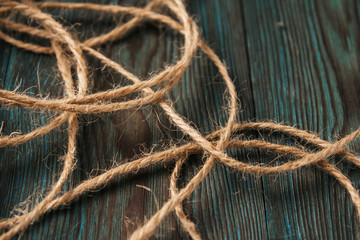  jute thread on a blue wooden background. decorative natural thread.