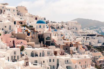 Fototapeta na wymiar Classical casual view on the decoration and architecture of Oia village Santorini at sun weather