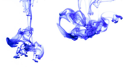 blue ink poured into water. white background