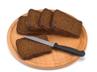 freshly baked bread on wooden cutting board isolated on white background, top view