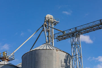 Looking up at grain elevator storage bin and elevator leg conveyor system